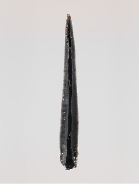 Ancient Cycladic obsidian blade, a prehistoric cutting tool traded across the Aegean Sea